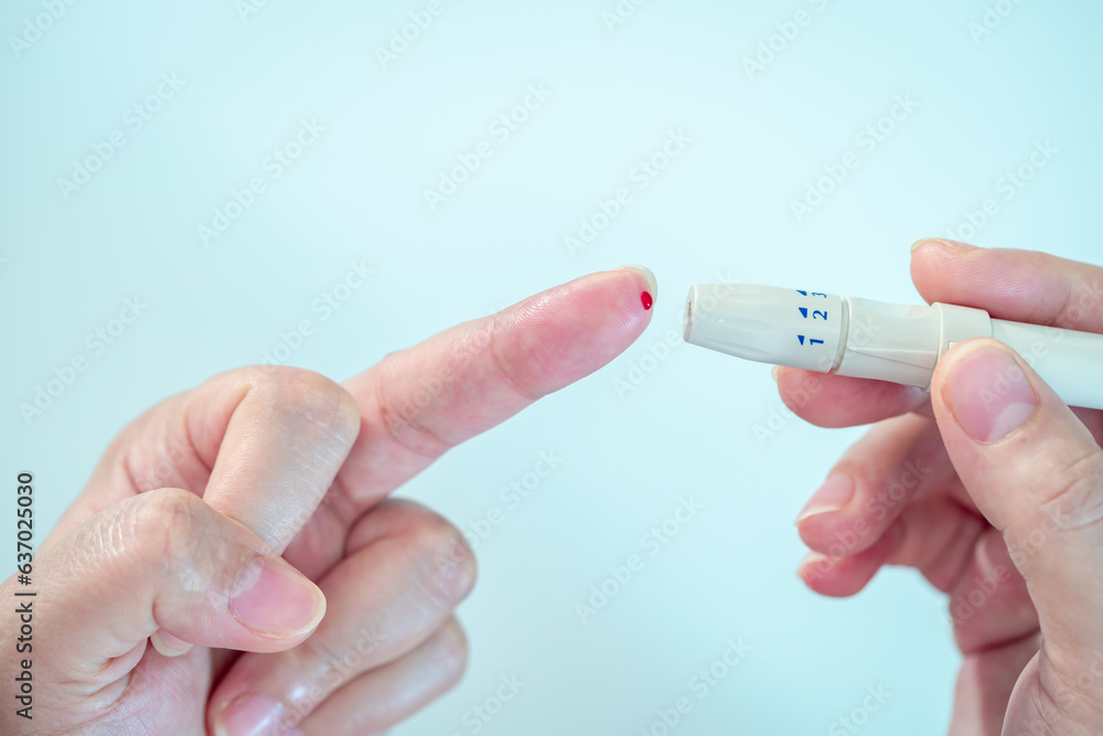 Close-up hand of pregnant woman hold sterile blood lancets and lancing ...