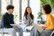 © Prostock-studio - Enthusiastic diverse students discussing study project in university classroom, sitting on chairs in circle
