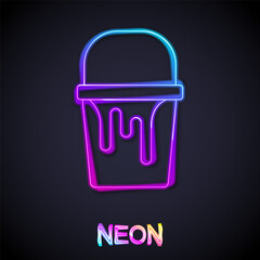 Wall Mural - Glowing neon line Paint bucket icon isolated on black background. Vector