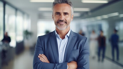 Confident mature business man with smile standing on blurred bright office background, CEO portrait concept.