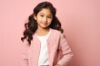 © Leon Waltz - Group portrait of an Indian child female against a pastel or soft colors background wearing a cardigan