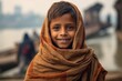 © Leon Waltz - Indian little boy wearing a headscarf on the banks of the river