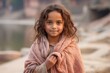 © Leon Waltz - Portrait of a beautiful little girl with long curly hair in a pink shawl
