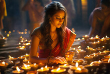 Indian Women Wearing Traditional Dress Lighting Diya Lamps At Temple On Diwali Night. Religious Ritual. 