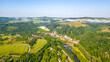 Cesky Sternberk castle and town on sunny summer morning. Aerial view from drone.