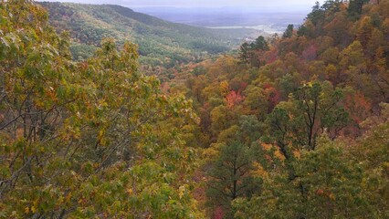 Wall Mural - Aerial drone mounting vista over mountains during autumn in Arkansas Ozark country with fall forest  