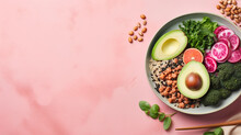 Vegan Buddha Or Poke Bowl Salad With Buckwheat, Vegetables And Seeds On Pink Background