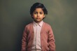 Lifestyle portrait of an Indian child male in a minimalist background