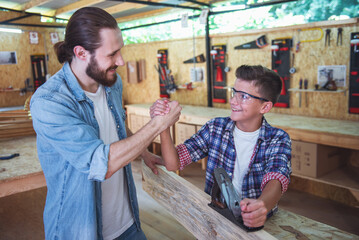 Wall Mural - Father and son working with wood