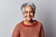 © Eber Braun - Lifestyle portrait of an Indian woman in her 70s in a minimalist background