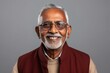 © Eber Braun - Medium shot portrait of an Indian man in his 70s in a minimalist background