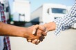 © Serhii - Logistics and Transportation Truck and Cargo ship with Business Collaboration, Businessman shake hands, logistic import export and transport industry background