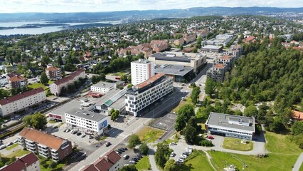 Wall Mural - Aerial cityscape of Lambertseter suburb houses of the city in Oslo with blue sky