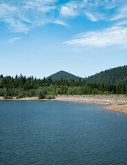 Wall Mural - Scenic view of a tranquil lake surrounded by greenery in Fuzina, Croatia