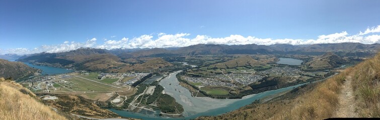 Sticker - Breathtaking panoramic shot of a tranquil lake and mountains