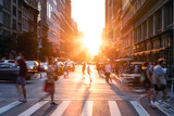 Fototapeta Nowy Jork - People and cars crossing a busy intersection on 5th Avenue and 23rd Street in New York City with the light of summer sunset shining between the background buildings