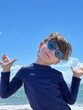 © Tamara Sales  - boy wearing goggles in the beach in south florida cocoa beach