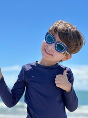 Wall Mural - boy wearing goggles in the beach in south florida cocoa beach 