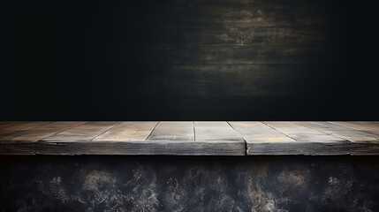 Old wooden table with blurred concrete block wall in dark room background, copy space