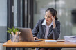© David - Portrait of tired young business Asian woman work with documents tax laptop computer in office. Sad, unhappy, Worried, Depression, or employee life stress concept