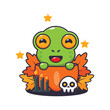 Cute frog in halloween pumpkin.