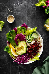 Poster - Vegan avocado fresh green salad bowl with red kidney beans, rice, red and chinese napa cabbage, healthy diet food, top view