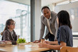 © bongkarn - A professional African American male teacher teaching English for Asian students in the class