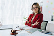 © Jirapong - Portrait of a Asian woman lawyer studying a lawsuit for a client before going to court