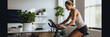 Woman engaging in an online fitness class with a stationary bike