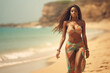 © wolfhound911 - Attractive african woman in bikini walking on the beach
