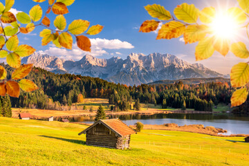 Wall Mural - panoramic view to rural landscape with mountain range and lake at autumn