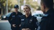 © Fred - Smiling blonde female police officer talking to her colleagues