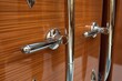 detail of luxurious yachts wood and chrome finishing touches