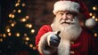 © Marco - santa claus thumbs up in front of a christmas tree in living room.