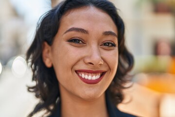 Sticker - Young beautiful hispanic woman smiling confident standing at street