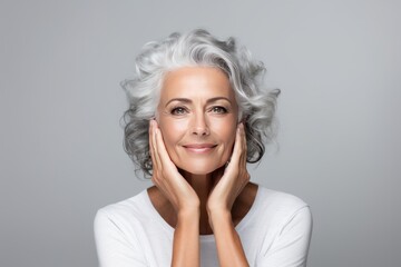 beautiful gorgeous 50s mid aged mature woman looking at camera isolated on white. mature old lady cl