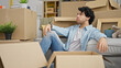 © Krakenimages.com - Young latin man sitting on floor stressed at new home