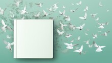 Blank Brand New Paper Notebook And Flying Birds. White Mockup. White Paper. Blank Rectangular Block Of Notes With Wide Writing Space. White-feathered Birds And Twigs In The Light Green Background.