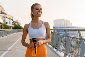 pretty young smiling woman doing sports in the morning in stylish sport outfit sportswear, skinny st
