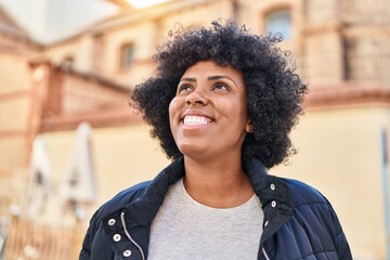 Poster - African american woman smiling confident looking to the sky at street