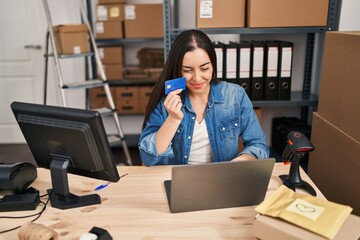 Canvas Print - Young beautiful hispanic woman ecommerce business worker using laptop and credit card at office