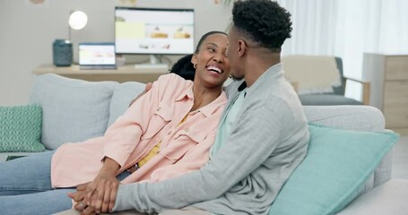 Poster - Couple, black people and laughing for communication in home with love, hug and care in living room. Man, woman and holding hands on sofa for funny joke, freedom or relax for conversation with partner