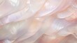 A soft, delicate peach fabric swirls around, inviting the viewer to get lost in its intricate texture and calming hue