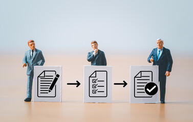 Fototapete - Miniature figure businessmen standing with white paper and document icon for prepare , check and approve document and project concept.