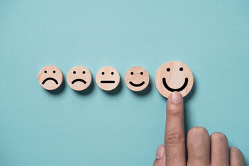 Poster - Hand touching to smile face on blue background for positive thinking and excellent evaluation after use product and service concept.