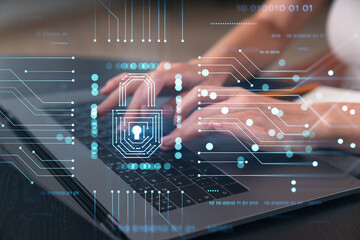 Woman typing on laptop at office workplace in background. Concept of working process, internet surfing, online business education. Student send e-mail. Close up view. Padlock icons
