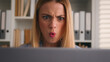 © Yuliia - Close up angry upset Caucasian woman user using laptop in home office frustrated mad confused shocked computer problem say what shock failure online stressed girl businesswoman mistake software error