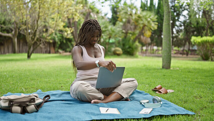 Poster - African american woman student using laptop sitting on floor at campus university