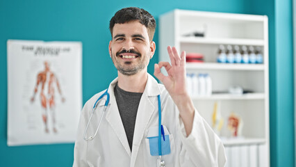 Sticker - Young hispanic man doctor doing ok gesture at clinic