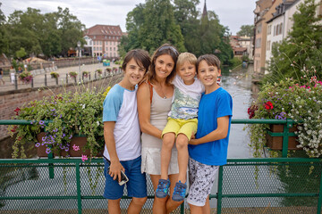 Wall Mural - Beautiful family with children, boys, visiting Strasbourg during summer vacation